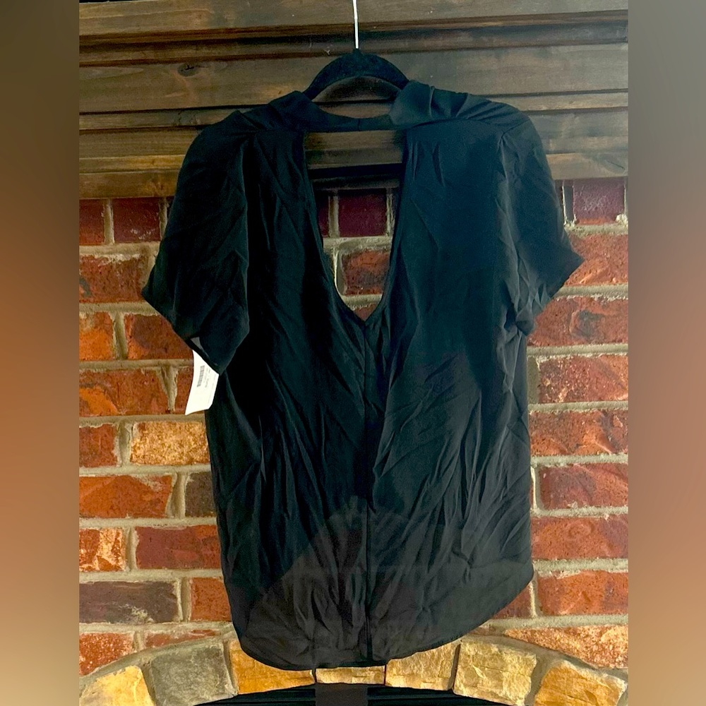 Black low cut and open back blouse